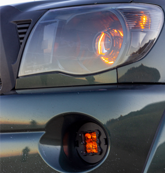 amber led fog light kit mounted on a toyota tacoma